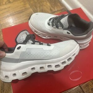 On Running White and Gray Sneakers